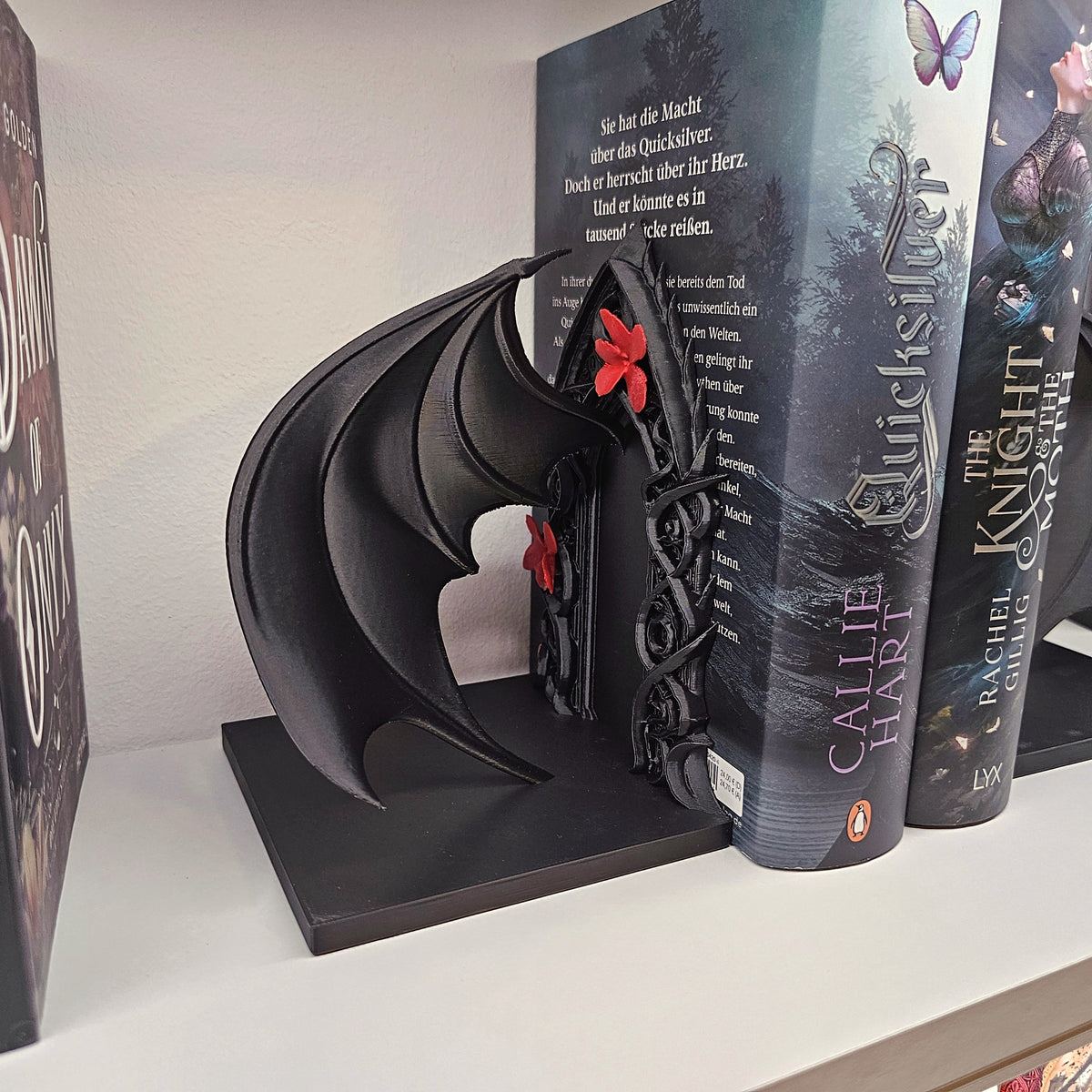 Buchstützen Flügel und Blüten Set Schwarz | Buchhalter