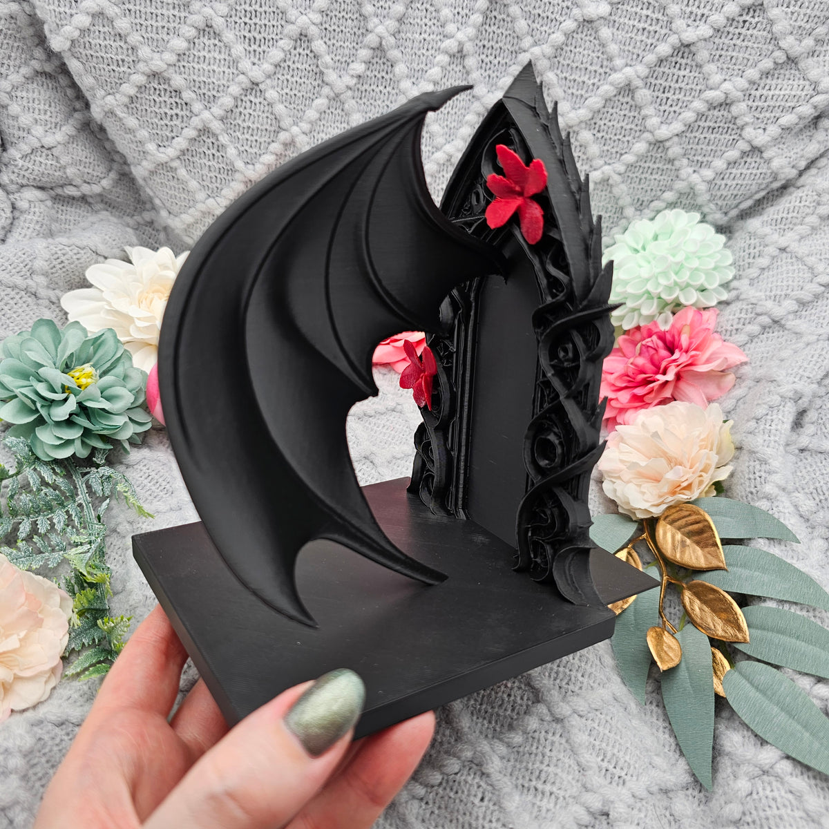 Buchstützen Flügel und Blüten Set Schwarz | Buchhalter