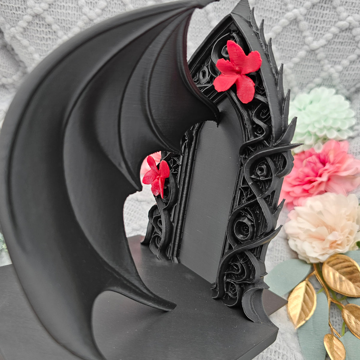 Buchstützen Flügel und Blüten Set Schwarz | Buchhalter